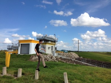 In the background, the bunker. In the foreground, my son jumping from post to post.